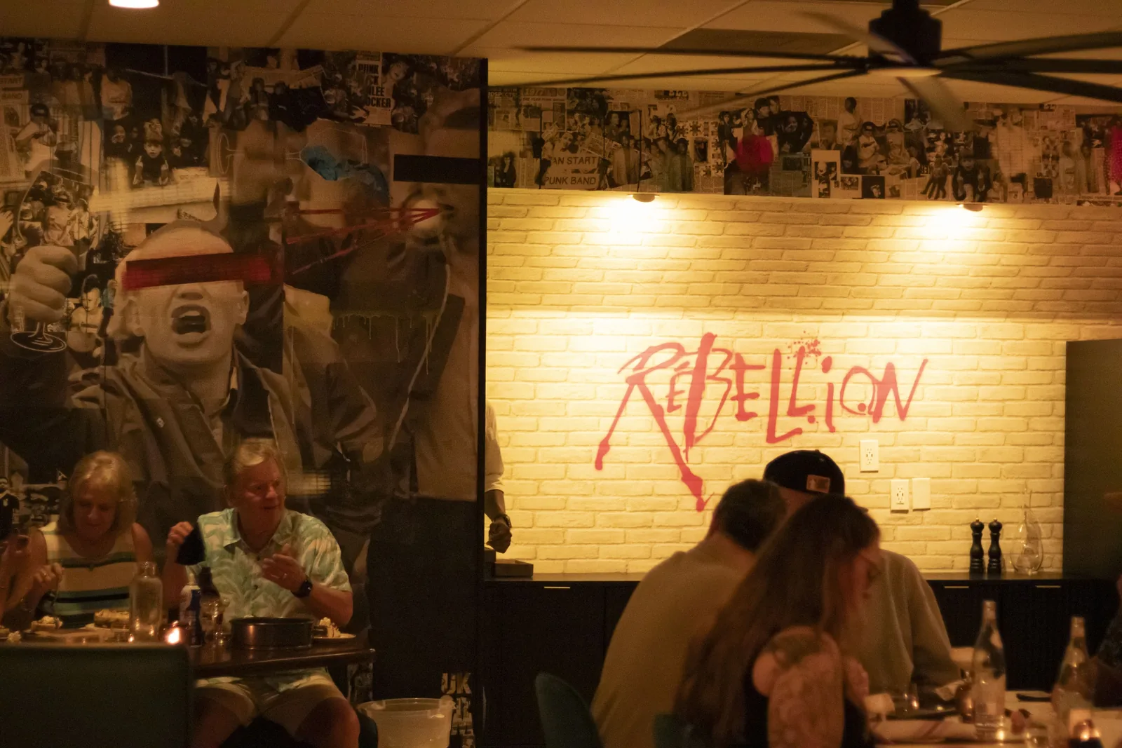 The dining room with the Rebellion mural painted across the back wall