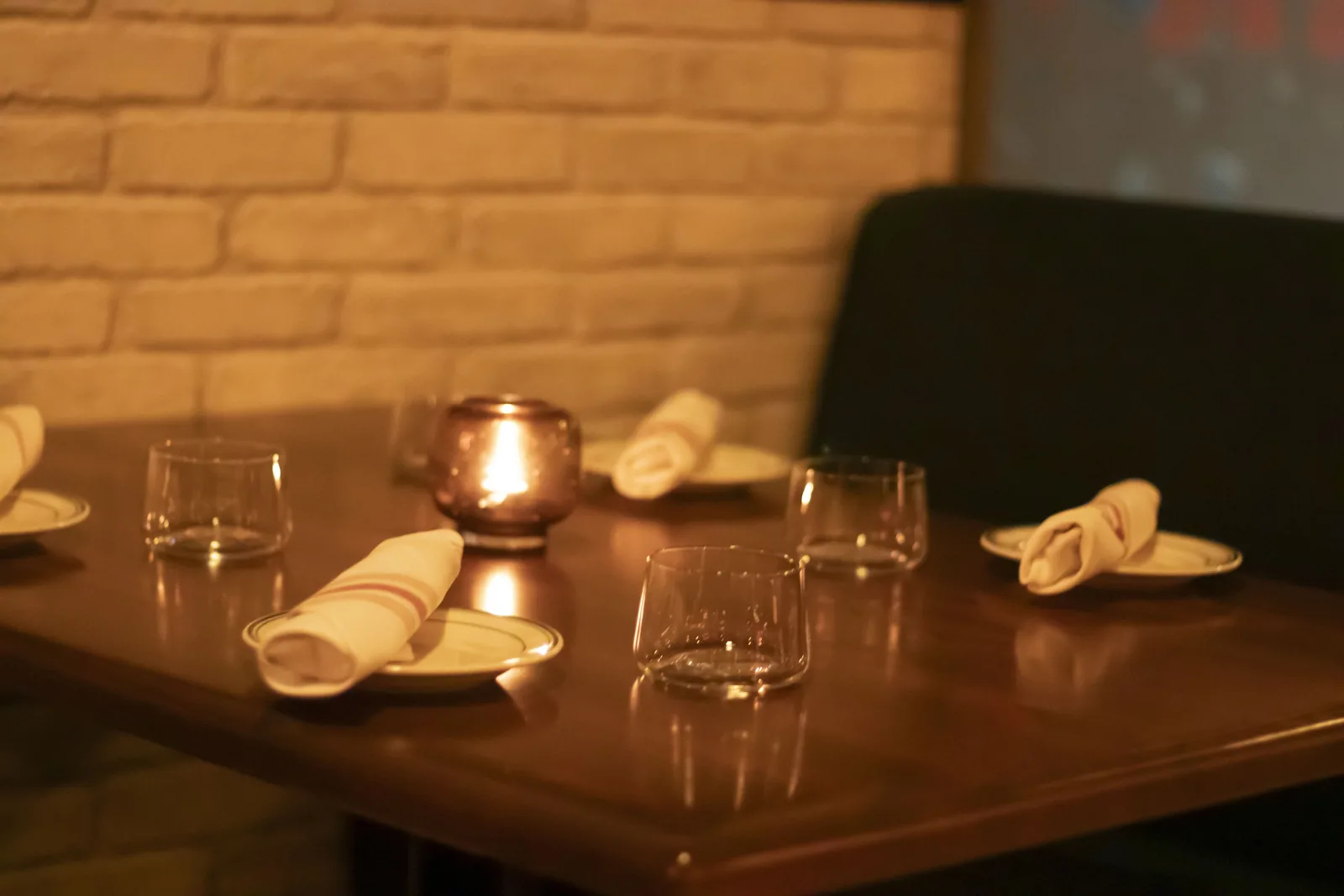 A shared board of dips, fries, cured meat and pickles spread across the table